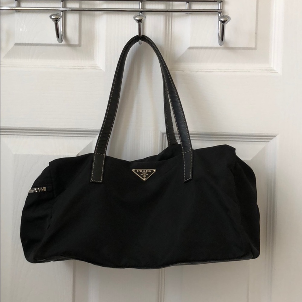 Prada. Authentic bag in nylon with leather straps